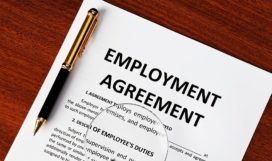 Employment agreement document on desk
